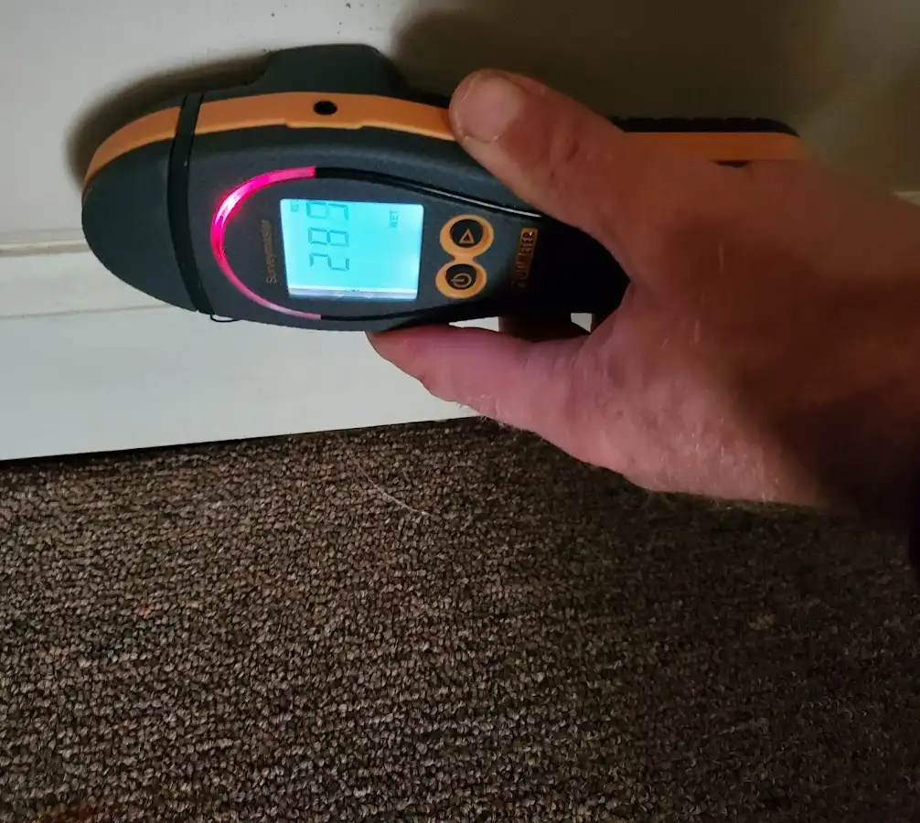 Moisture detection at baseboard during Storm Damage Restoration in Sanibel